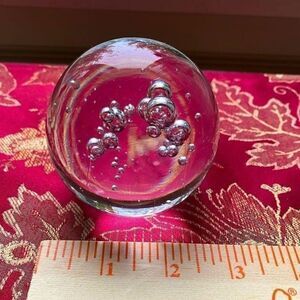 Crystal ball paperweight with bubbles inside